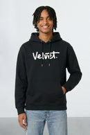 Person wearing a black hoodie with 'Velvet' logo on a light background