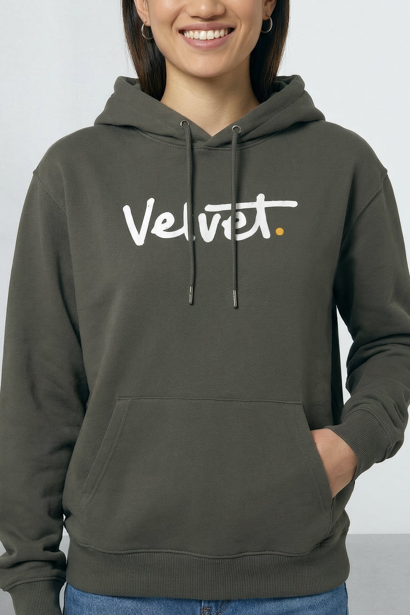 Person wearing a Khaki green hoodie with 'Velvet' logo on a light background