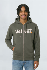 Person wearing a Khaki green hoodie with 'Velvet' text on a light background
