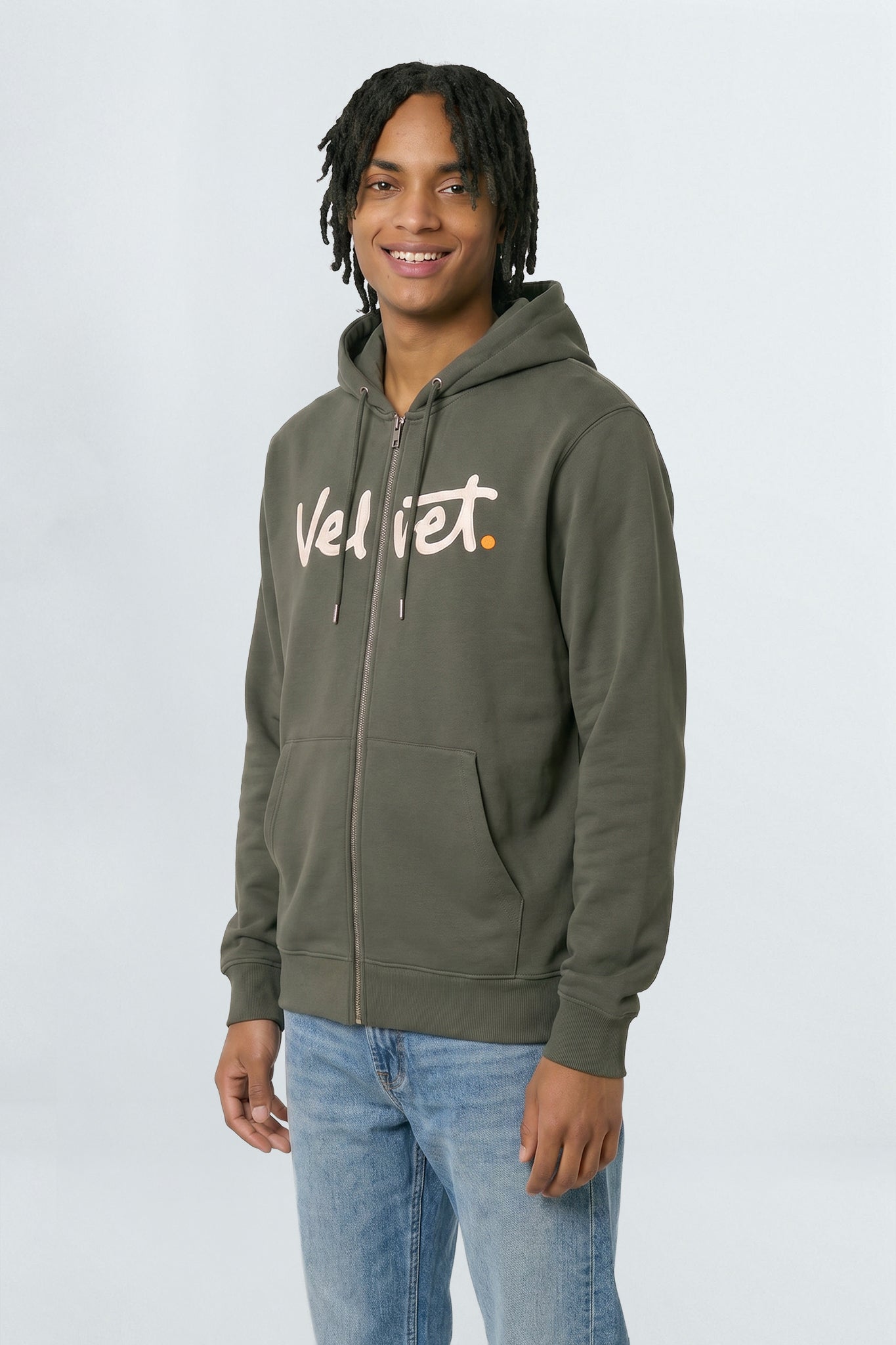 Person wearing a Khaki green hoodie with 'Velvet' text on a light background