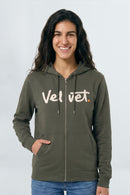 Woman wearing a Khaki green hoodie with 'Velvet' logo on a light background