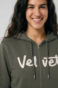 Person wearing a Khaki green hoodie with 'Velvet' branding on a plain background