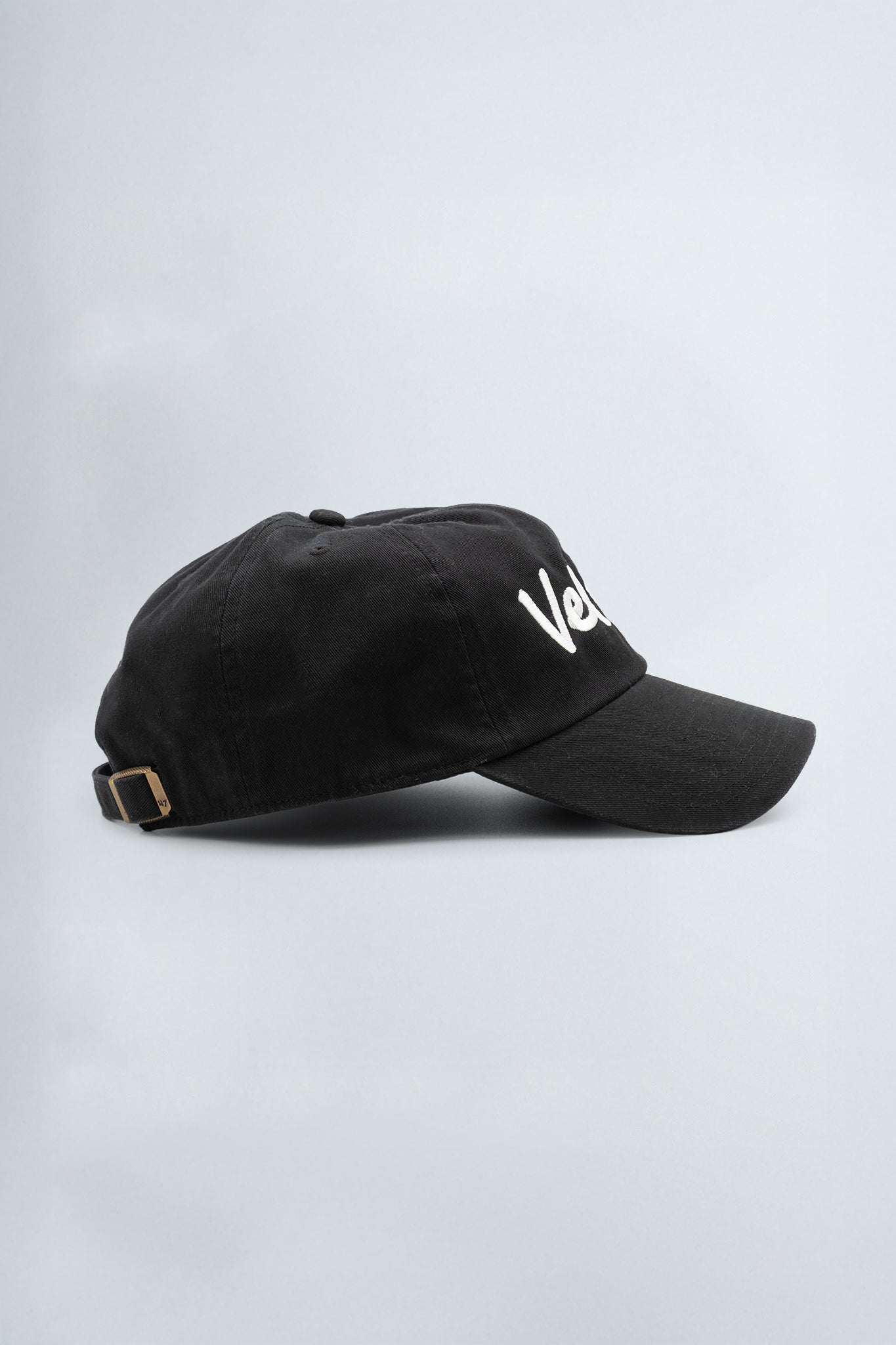 Black cap with 'Velevt' logo on a light gray background