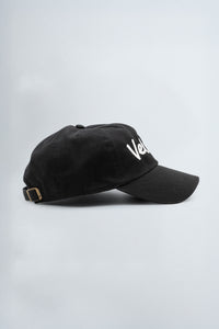 Black cap with 'Velevt' logo on a light gray background