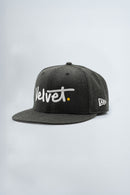 Gray cap with 'Velvet' logo on a light background