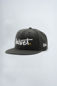 Gray cap with 'Velvet' logo on a light background