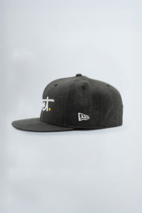 Black cap with white logo on a light background
