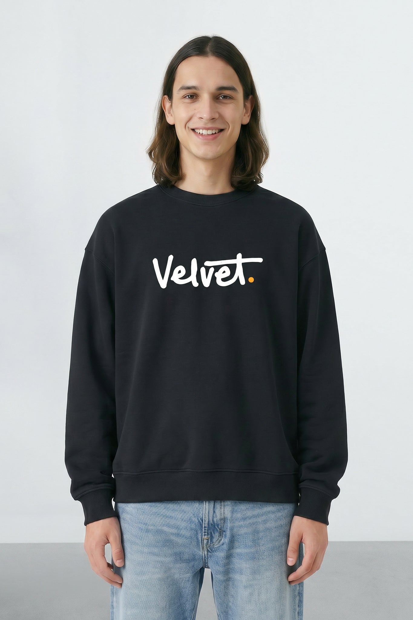 Person wearing a black sweatshirt with 'Velvet' text on a light background