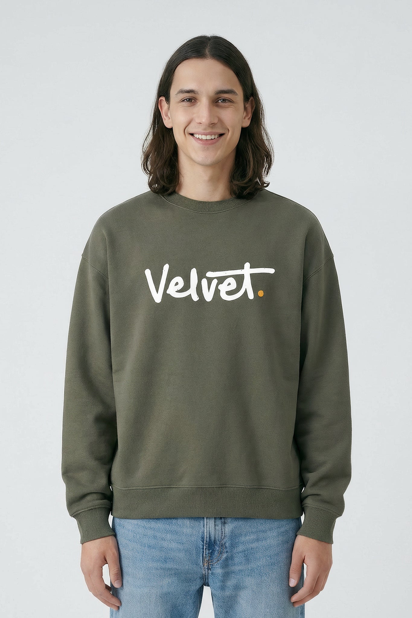 Person wearing a Khaki green sweatshirt with 'Velvet' text on a light background