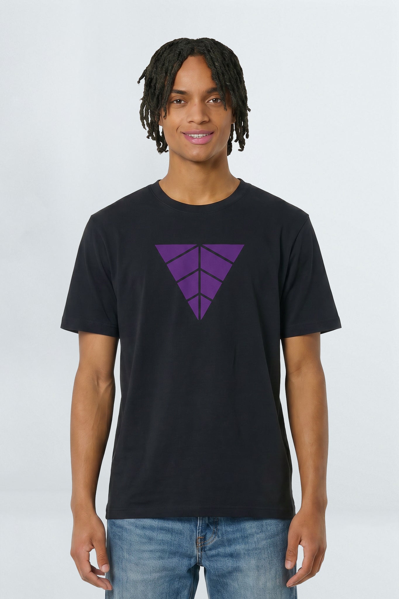 Person wearing a black t-shirt with a purple geometric design on a light background