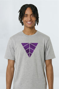 Person wearing a heather gray t-shirt with a purple geometric logo on a light background