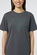 Person wearing a gray t-shirt with a geometric triangle design on a plain background