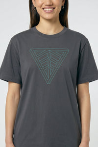 Person wearing a gray t-shirt with a geometric triangle design on a plain background