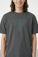 Person wearing a gray t-shirt with a geometric triangle design on a plain background