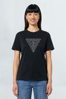 Person wearing a black t-shirt with a geometric triangle design on a plain background
