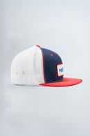 Cap with white front panel, navy side panel, and red brim on a light gray background