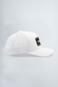 White cap with a black logo patch on a light background