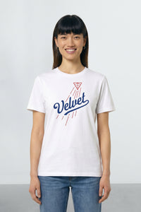 Person wearing a white t-shirt with 'Velvet' design on a plain background