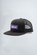 Black mesh cap with purple 'velvet' logo on a light background