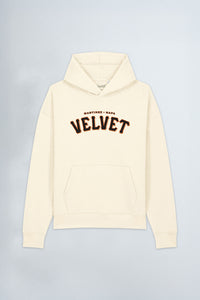 Cream hoodie with 'Velvet' text on a light background
