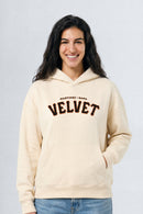 Woman wearing a cream hoodie with 'Martinez Napa Velvet' text on a plain background