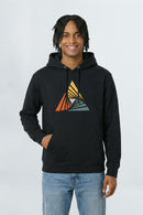 Person wearing a black hoodie with a colorful triangle design on a light background