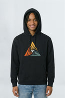 Person wearing a black hoodie with a colorful triangle design on a light background