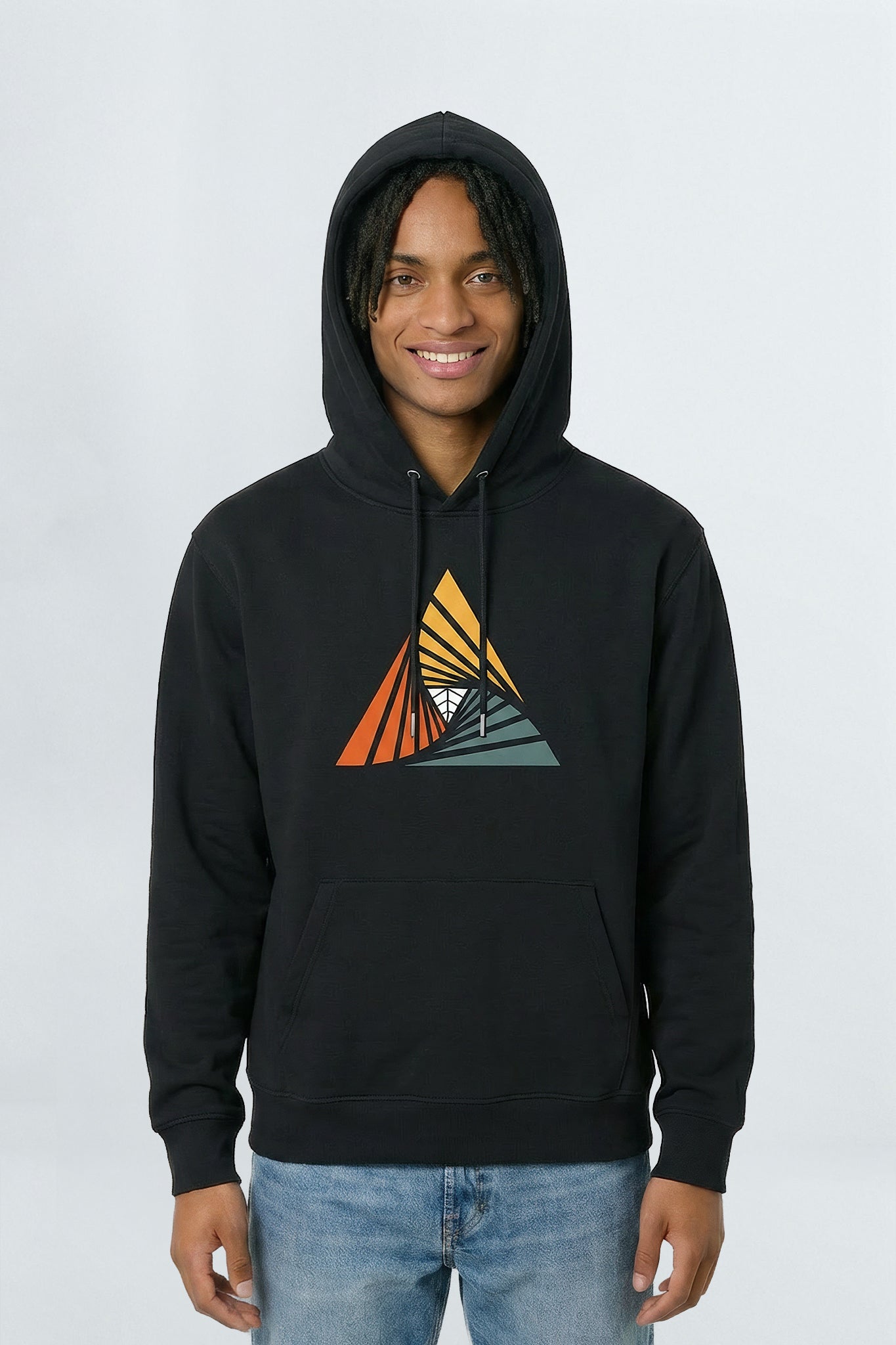 Person wearing a black hoodie with a colorful triangle design on a light background