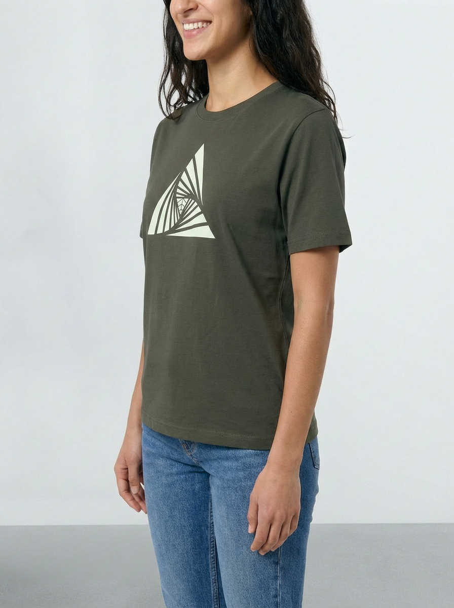 Woman wearing a Khaki green t-shirt with a white geometric design on a plain background
